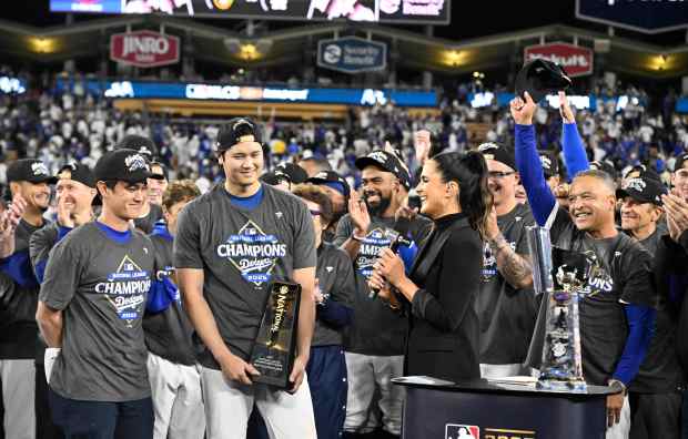 Dodgers star Shohei Ohtani holds the NLCS MVP trophy after...