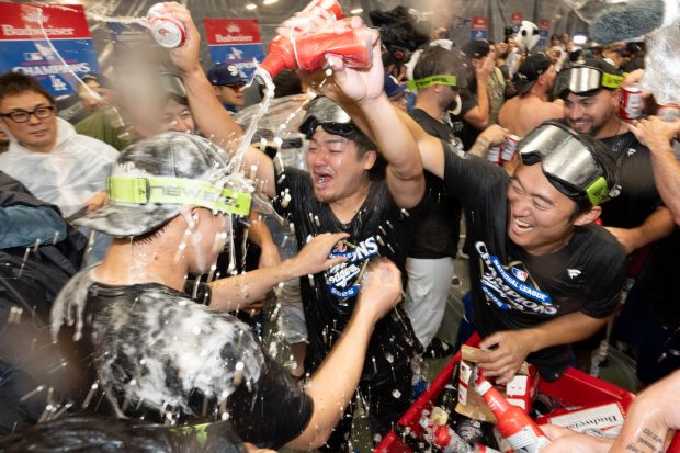 The Dodgers celebrate after their 5-1 victory over the Milwaukee...
