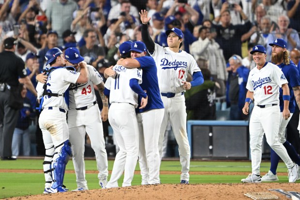 The Dodgers celebrate after their 5-1 victory over the Milwaukee...
