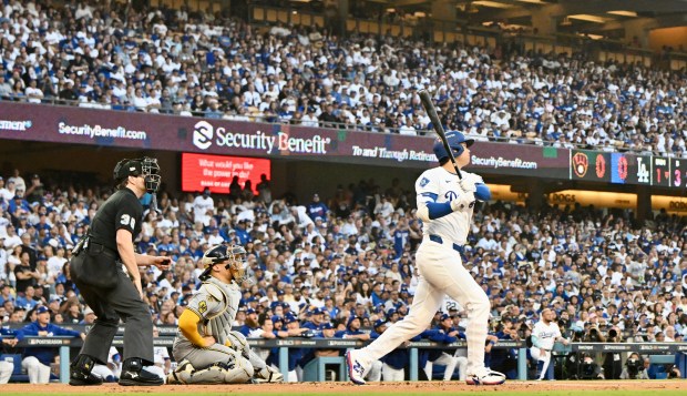 Dodgers star Shohei Ohtani watches the flight of his solo...