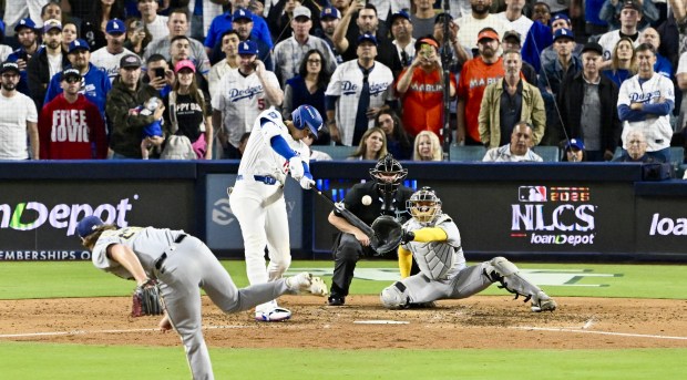 Dodgers star Shohei Ohtani hits a solo home run during...
