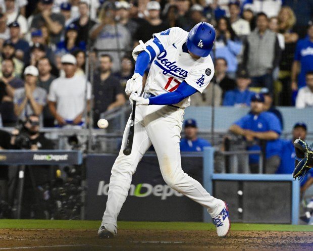 Dodgers star Shohei Ohtani hits a solo home run during...