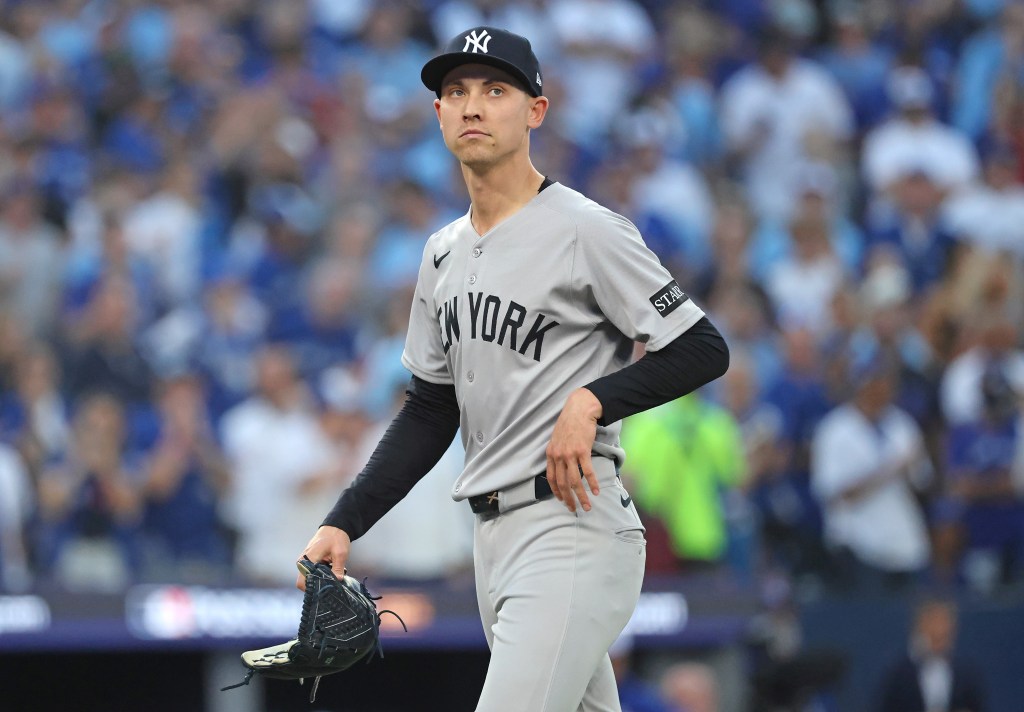 A dejected Luke Weaver walks to the dugout after being taken out of the game in the seventh inning of the Yankees' 10-1 blowout loss to the Blue Jays in Game 1 of the ALDS on Oct. 4, 2025. 
