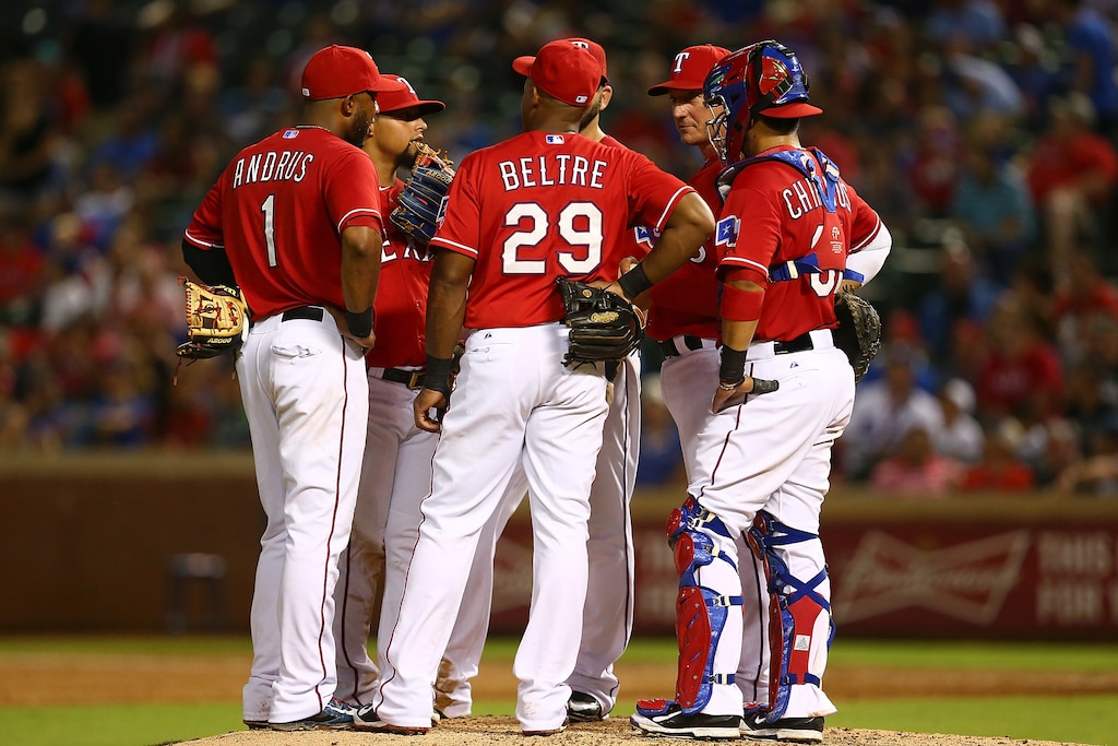 ARLINGTON, TX - JULY 07: Adrian Beltre #29, Elvis Andrus #1, and Robinson Chirinos #61 of the Texas Rangers talk at the pitcher's mound in the eighth inning during a game against the Arizona Diamondbacks at Globe Life Park in Arlington on July 7, 2015 in Arlington, Texas. The Arizona Diamondbacks defeated the Texas Rangers 4-2.