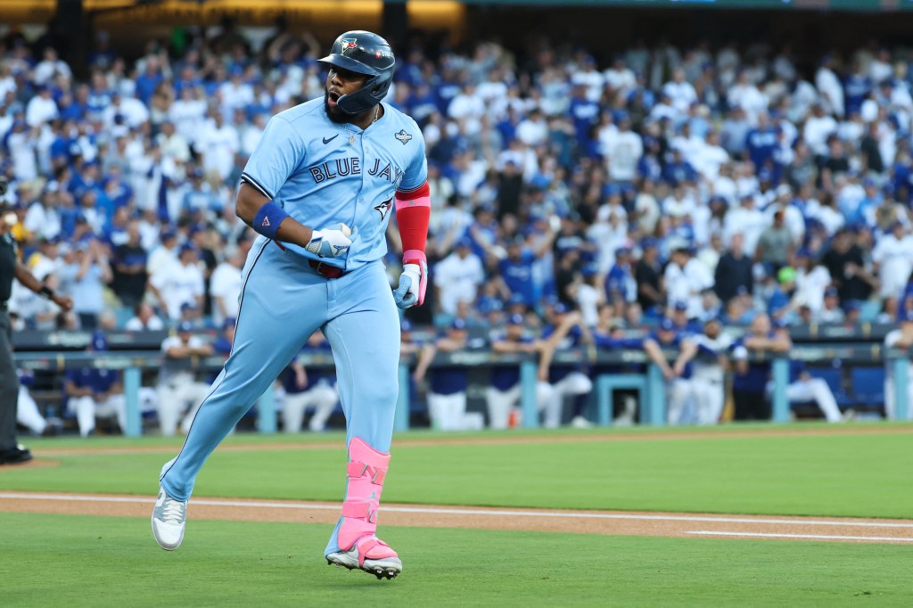 Toronto Blue Jays first baseman Vladimir Guerrero Jr. (27) celebrates after hitting a solo home run during the first inning against the Los Angeles Dodgers during game five of the 2025 MLB World Series at Dodger Stadium. 
