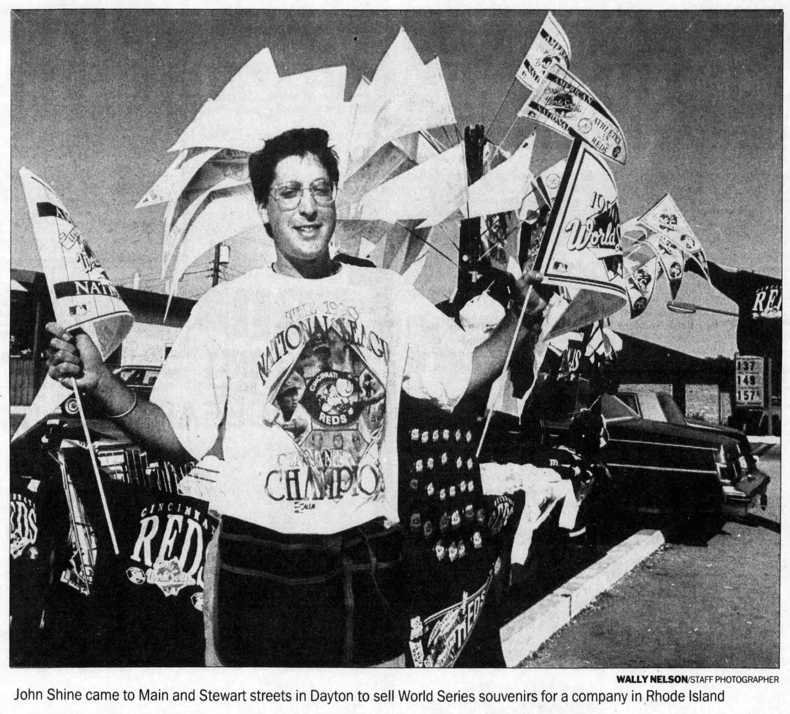 Vendors from as far away as Rhode Island, including John Shine, ascended upon Reds country to sell Reds buttons, shirts, hats and more during the 1990 World Series. DAYTON DAILY NEWS ARCHIVES