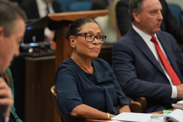 Attorney Shawn Holley looks on before opening statements in the...
