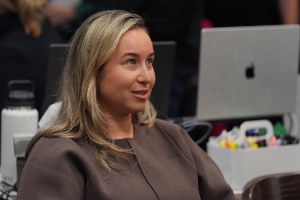Carli Skaggs, widow of pitcher Tyler Skaggs, looks on before...