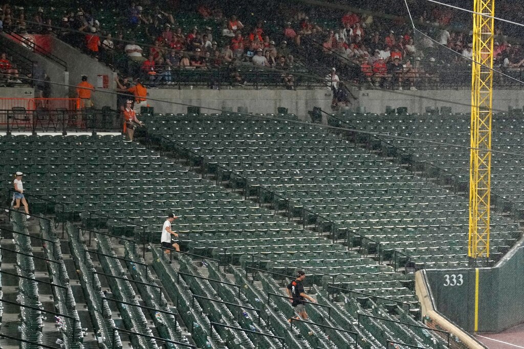 The Baltimore Orioles continue to play through their game against the Colorado Rockies even after fans were cleared from the seating bowl after lightning was reported in the area at Oriole Park at Camden Yards in Baltimore, Md. on Friday, July 25, 2025.