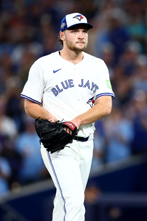 Trey Yesavage #39 of the Toronto Blue Jays walks to...