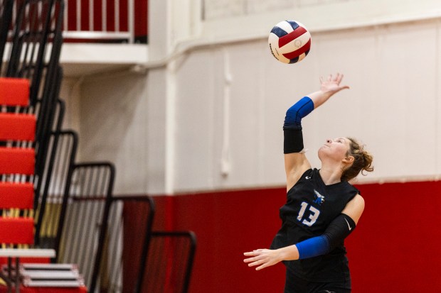 Lincoln-Way East's Brooklyn Ritter (13) serves against Homewood-Flossmoor during a Southwest Suburban Conference game in Flossmoor on Tuesday, Oct. 21, 2025. (Vincent D. Johnson / for the Daily Southtown)