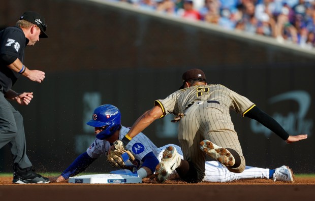 Nico Hoerner #2 of the Chicago Cubs is tagged out by Xander Bogaerts #2 of the San Diego Padres in the first inning during Game 3 of the NL Wild Card Series at Wrigley Field on Oct. 2, 2025 in Chicago, Illinois. (Photo by K.C. Alfred / The San Diego Union-Tribune)