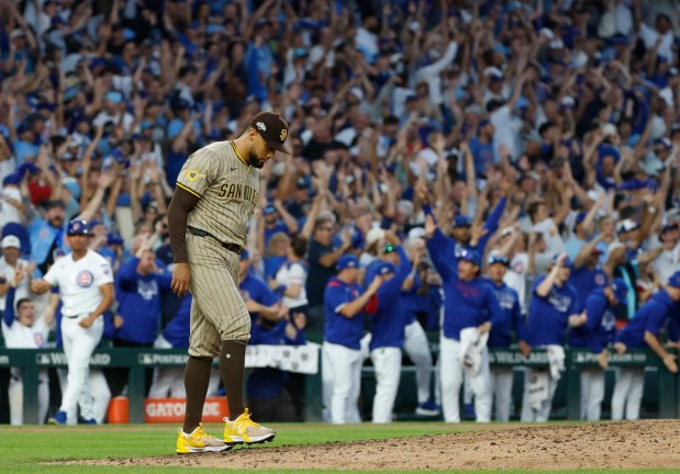 Robert Suarez #75 of the San Diego Padres walks back to the mound after giving up a home run to Michael Busch #29 of the Chicago Cubs in the seventh inning during Game 3 of the NL Wild Card Series at Wrigley Field on Oct. 2, 2025 in Chicago, Illinois. (Photo by K.C. Alfred / The San Diego Union-Tribune)