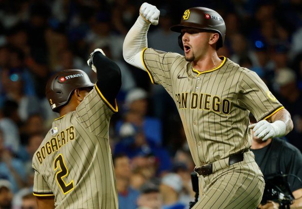 Jackson Merrill #3 of the San Diego Padres celebrates a home run in the ninth inning with Xander Bogaerts #2 against the Chicago Cubs in Game 3 of the NL Wild Card Series at Wrigley Field on Oct. 2, 2025 in Chicago, Illinois. (Photo by K.C. Alfred / The San Diego Union-Tribune)
