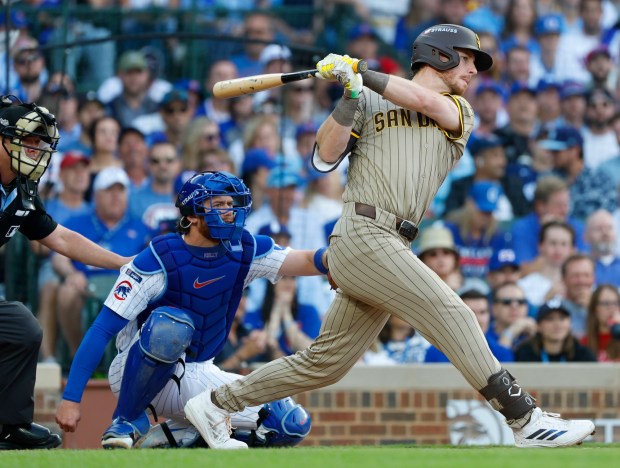 Ryan O'Hearn #32 of the San Diego Padres hits a single against the Chicago Cubs in Game 3 of the NL Wild Card Series at Wrigley Field on Oct. 2, 2025 in Chicago, Illinois. (Photo by K.C. Alfred / The San Diego Union-Tribune)