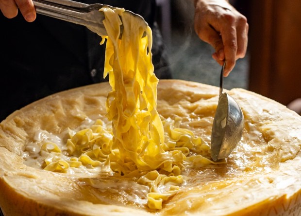 A cheese wheel pasta from Roman Wolves, which is offering 50% off the normal price on National Pasta Day. (Arlene Ibarra)