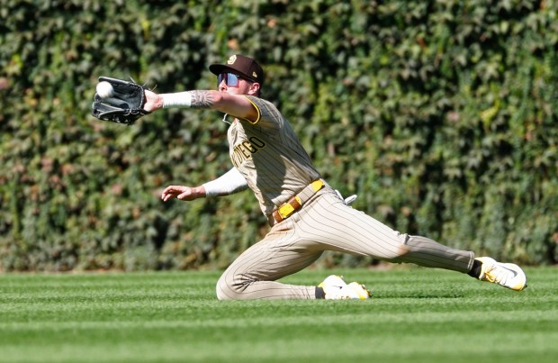 Jackson Merrill #3 of the San Diego Padres catches a fly ball hit by Seiya Suzuki #27 of the Chicago Cubs in the second inning during Game 1 of the NL Wild Card Series at Wrigley Field on Sept. 30, 2025 in Chicago, Illinois. (Photo by K.C. Alfred / The San Diego Union-Tribune)