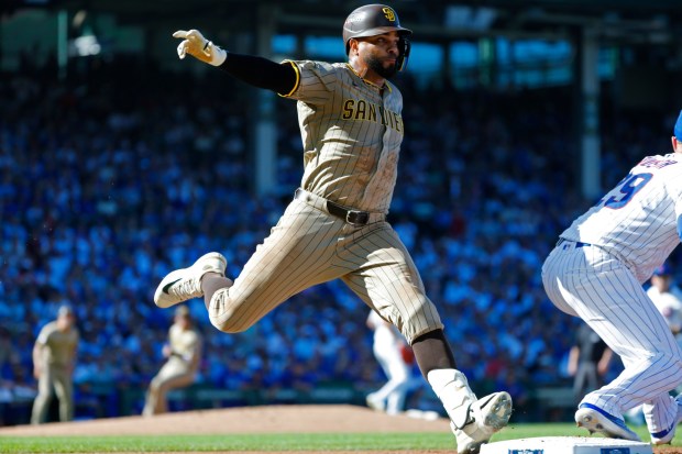 Xander Bogaerts #2 of the San Diego Padres beats out a throw at first bas against the Chicago Cubs during Game 1 of the NL Wild Card Series at Wrigley Field on Sept. 30, 2025 in Chicago, Illinois. (Photo by K.C. Alfred / The San Diego Union-Tribune)