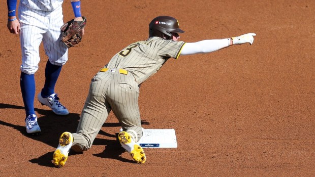 Jackson Merrill #3 of the San Diego Padres celebrates after a double against the Chicago Cubs during the second inning during game one of the NL Wild Card Series at Wrigley Field on Tuesday, Sept. 30, 2025 in Chicago, Illinois. (Meg McLaughlin / The San Diego Union-Tribune)