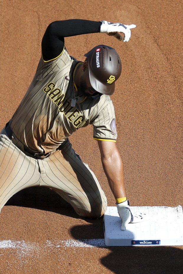 Xander Bogaerts #2 of the San Diego Padres gestures after sliding safely into third base against the Chicago Cubs during the second inning during game one of the NL Wild Card Series at Wrigley Field on Tuesday, Sept. 30, 2025 in Chicago, Illinois. (Meg McLaughlin / The San Diego Union-Tribune)