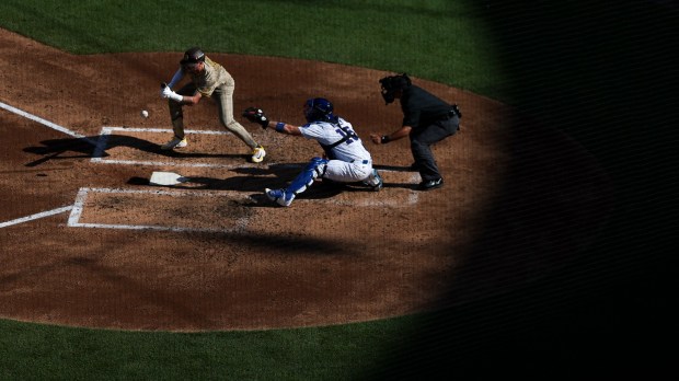 Jackson Merrill #3 of the San Diego Padres bunts against the Chicago Cubs during the fourth inning during game one of the NL Wild Card Series at Wrigley Field on Tuesday, Sept. 30, 2025 in Chicago, Illinois. (Meg McLaughlin / The San Diego Union-Tribune)