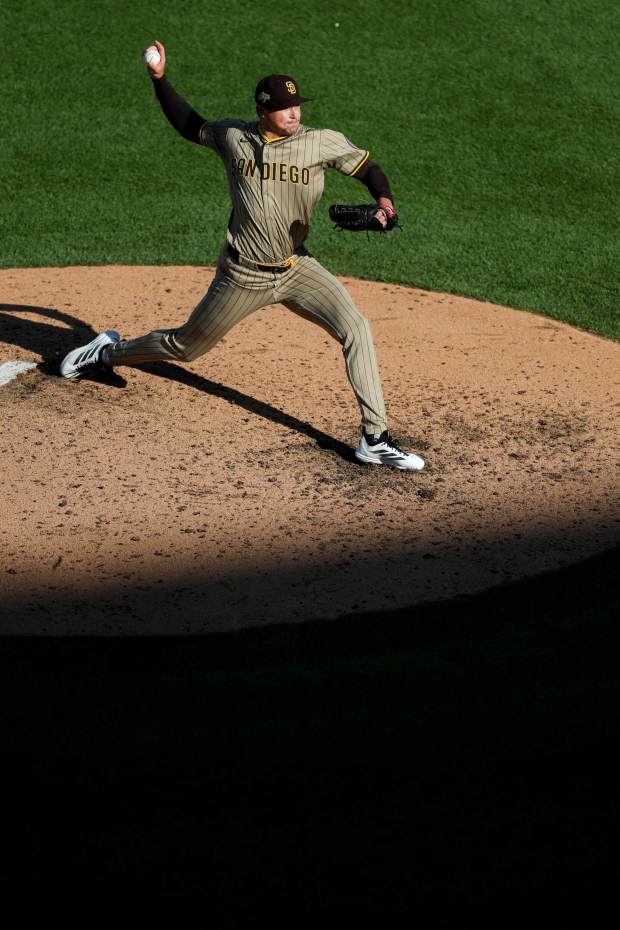 Mason Miller #22 of the San Diego Padres pitches against the Chicago Cubs during the seventh inning during game one of the NL Wild Card Series at Wrigley Field on Tuesday, Sept. 30, 2025 in Chicago, Illinois. (Meg McLaughlin / The San Diego Union-Tribune)