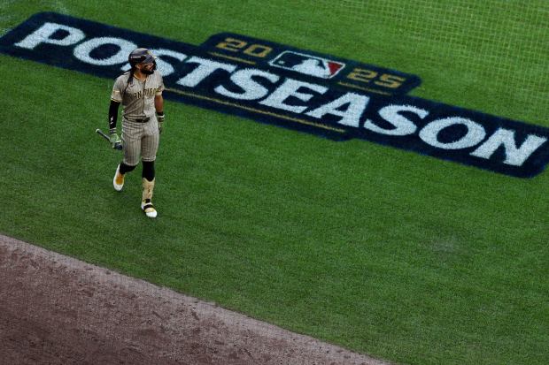 Fernando Tatis Jr. walks back to the Padres' dugout after striking out in the eighth inning of Tuesday's loss to the Cubs In Game 1 of the NL Wild Card Series. (Meg McLaughlin / The San Diego Union-Tribune)