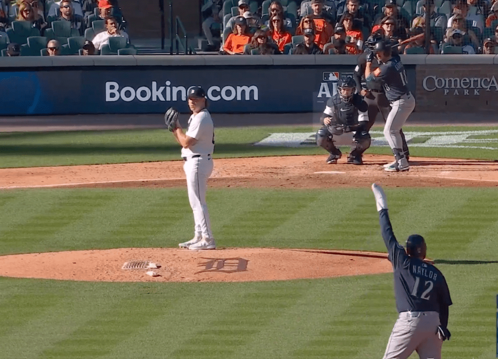 Josh Naylor waved his arms while on second base for the Mariners on Oct. 8, 2025.