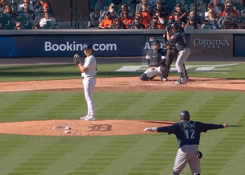 Josh Naylor waved his arms while on second base for the Mariners on Oct. 8, 2025.