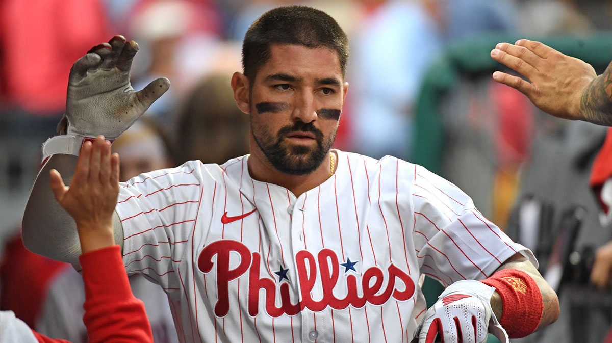 Philadelphia Phillies outfielder Nick Castellanos (8) celebrates in the dugout after scoring a run during the second inning against the Seattle Mariners at Citizens Bank Park.