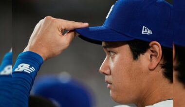 Los Angeles Dodgers' Shohei Ohtani watches from the dugout during the fifth inning in Game 1 of the National League Wild Card baseball playoff series against the Cincinnati Reds, Tuesday, Sept. 30, 2025, in Los Angeles. (AP Photo/Mark J. Terrill)