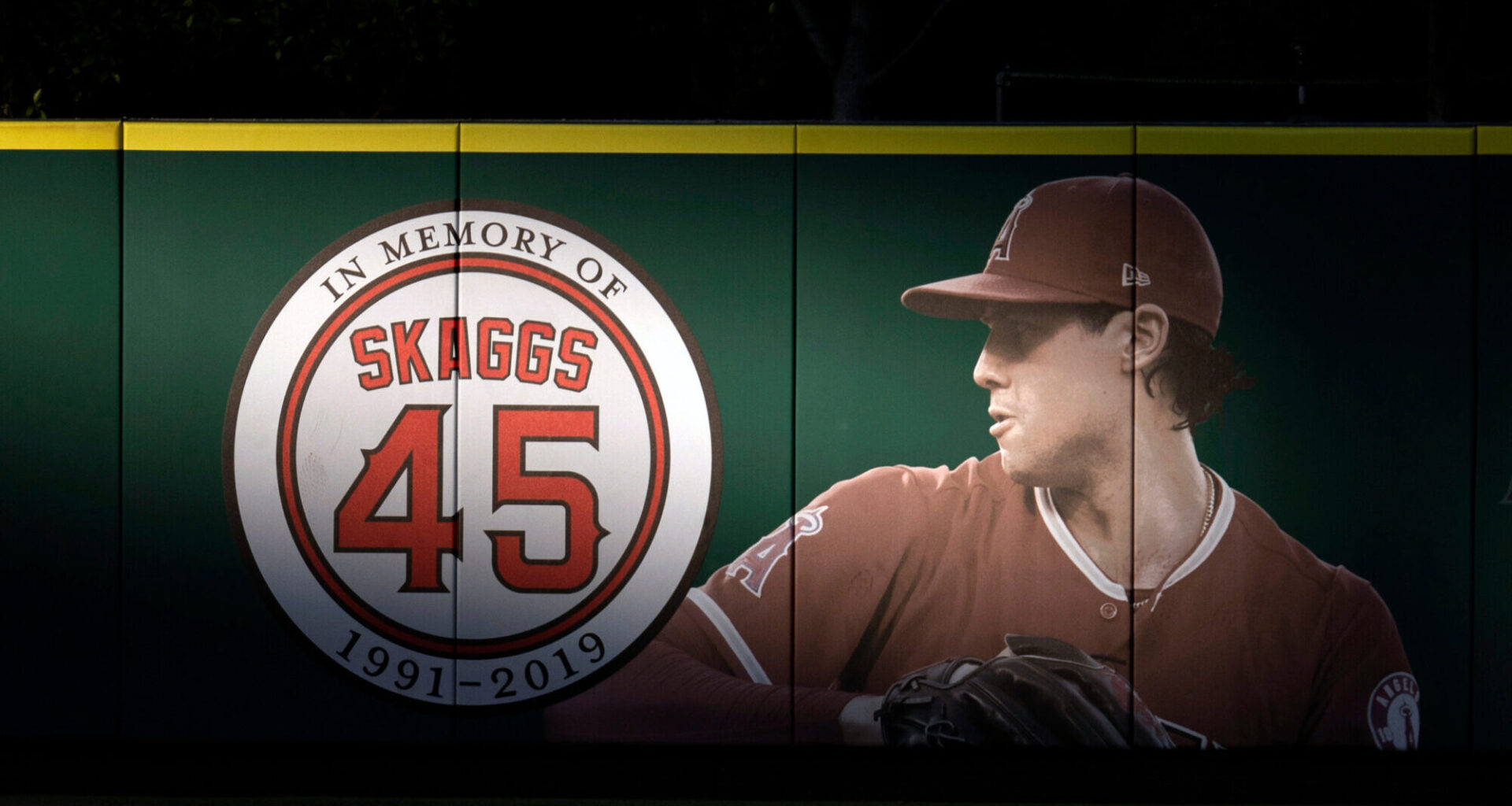 FILE - An image and logo memorializing former Los Angeles Angels pitcher Tyler Skaggs is displayed ...