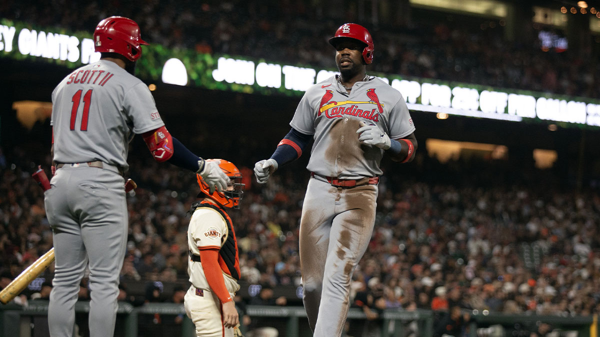 St. Louis Cardinals right fielder Jordan Walker (18) is greeted by teammate Victor Scott II (11) as he scores on a single by Alec Burleson against the San Francisco Giants during the fourth inning at Oracle Park.