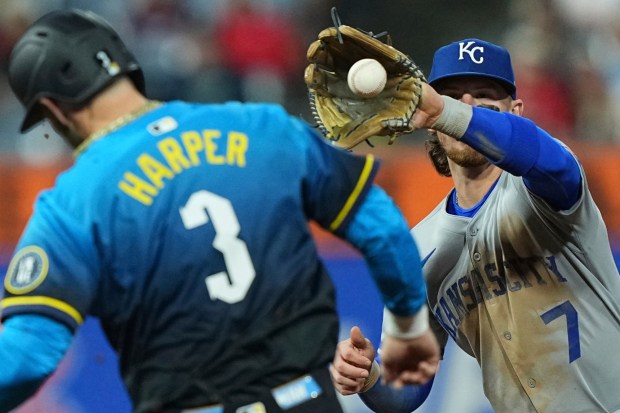Philadelphia Phillies' Bryce Harper (3) is forced out by Kansas City Royals shortstop Bobby Witt Jr. during the fourth inning of a baseball game, Friday, Sept. 12, 2025, in Philadelphia. (AP Photo/Matt Rourke)