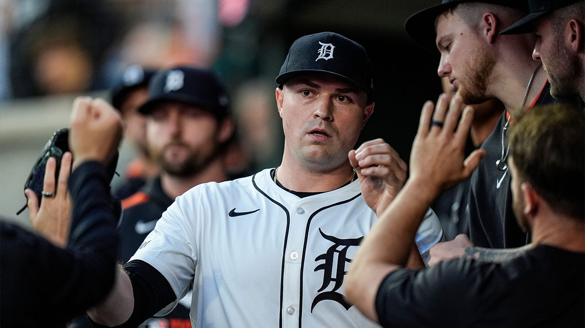 Detroit Tigers pitcher Tarik Skubal (29) high-fives teammates in the dugout after pitching change during the seventh inning at Comerica Park.