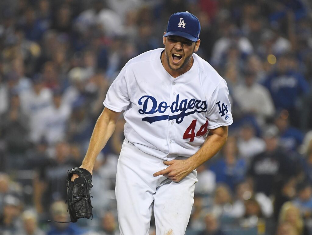Los Angeles Dodgers pitcher Rich Hill (44) reacts after walking Boston Red Sox shortstop Xander Bogaerts (not pictured) in the seventh inning in game four of the 2018 World Series at Dodger Stadium.