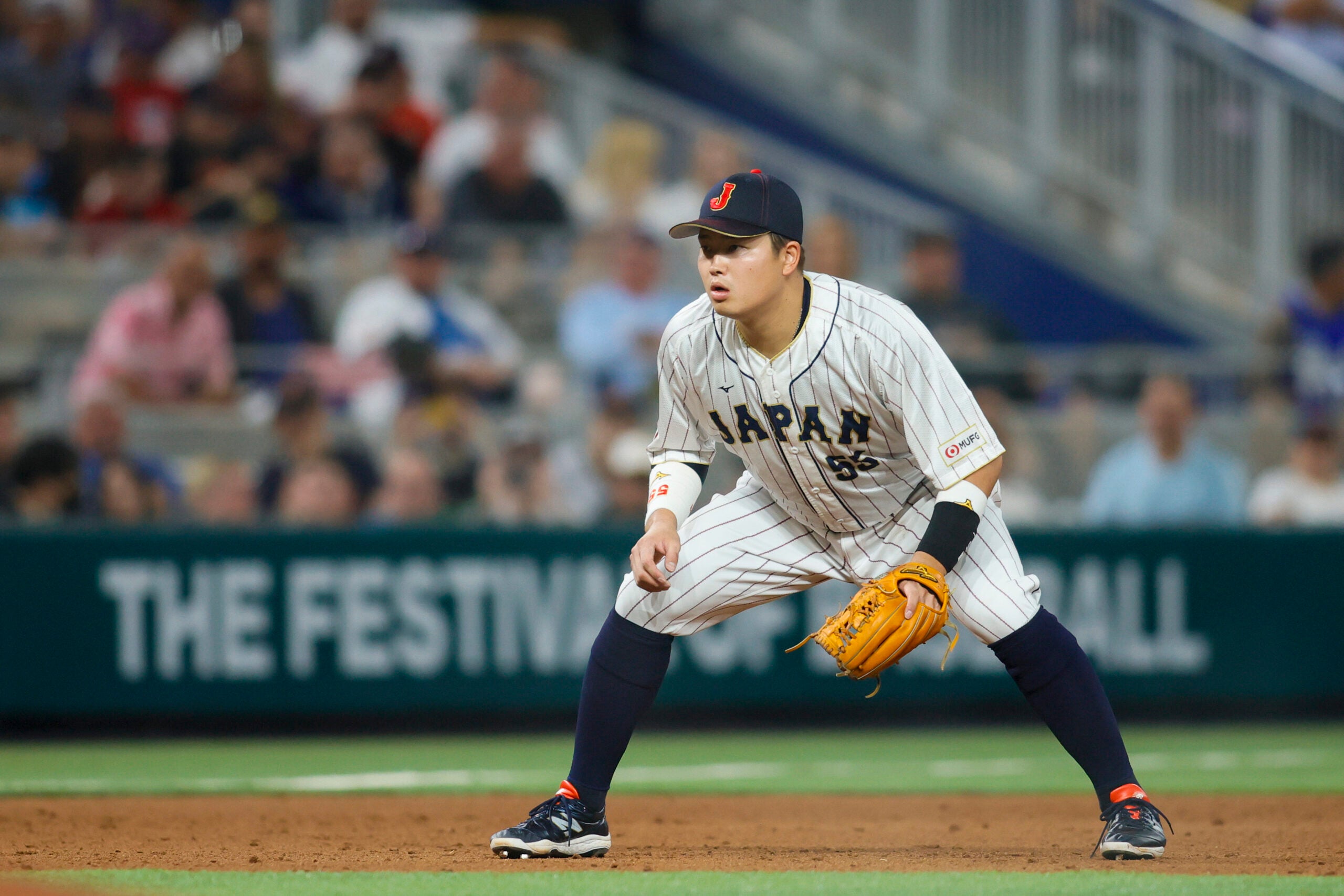 Japan third baseman Munetaka Murakami (55) plays his position during the sixth inning against the USA at LoanDepot Park. (Sam Navarro-USA TODAY Sports)