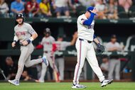 Texas Rangers pitcher Luke Jackson reacts after giving up a three-run home run to Boston Red...