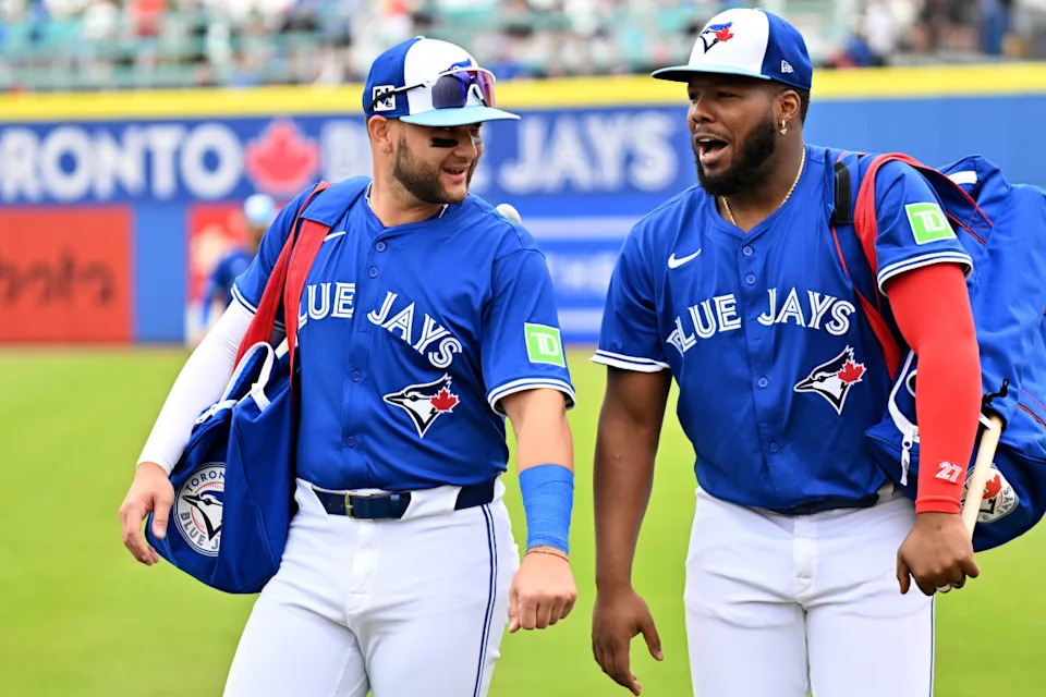 Toronto Blue Jays shortstop Bo Bichette (11) and first baseman Vladimir Guerrero Jr. (27).Jonathan Dyer-Imagn Images