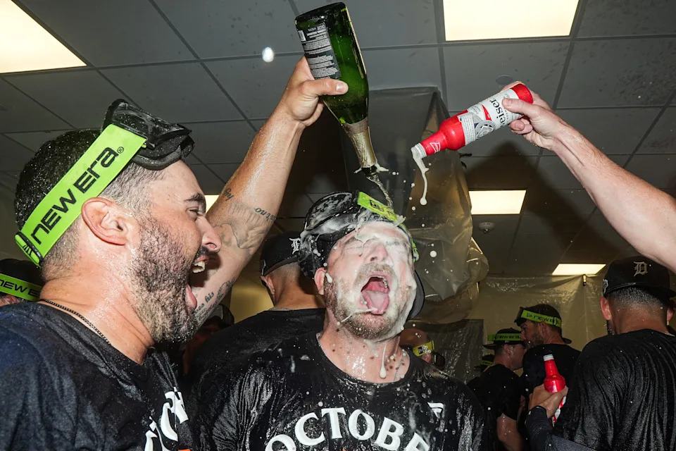 Detroit Tigers bullpen coach Chris Chinea, left, and catcher Jake Rogers (34) celebrate 6-3 win over Cleveland Guardians in Game 3 of AL wild-card series at Progressive Field in Cleveland on Thursday, Oct. 2, 2025.
