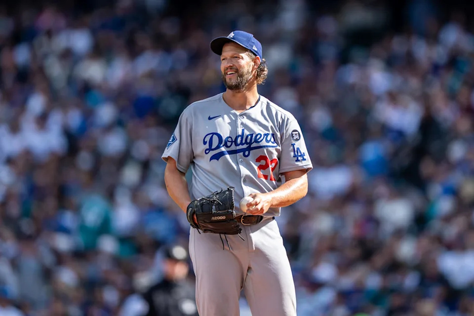 SEATTLE, WA - SEPTEMBER 28: Starting pitcher Clayton Kershaw #22 of the Los Angeles Dodgers smiles while waiting to be taken out of a game against the Seattle Mariners at T-Mobile Park on September 28, 2025 in Seattle, Washington. The Dodgers won 6-1.(Photo by Stephen Brashear/Getty Images)