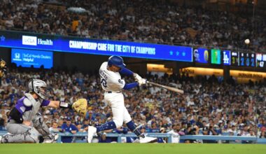Los Angeles Dodgers' Mookie Betts right, hits a two-run home run as Colorado Rockies catcher Hunter Goodman watches during the third inning of a baseball game Tuesday in LA. (AP Photo/Mark J. Terrill)