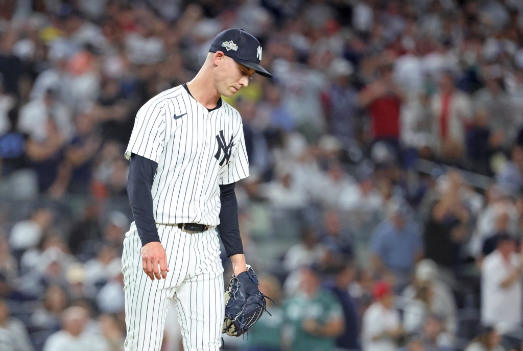 New York Yankees pitcher Luke Weaver reacts after giving up a two-run single.