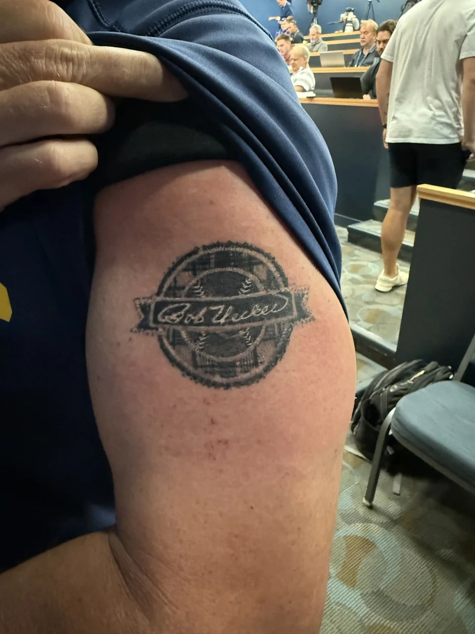 Brewers manager Pat Murphy shows off his Bob Uecker patch tattoo.