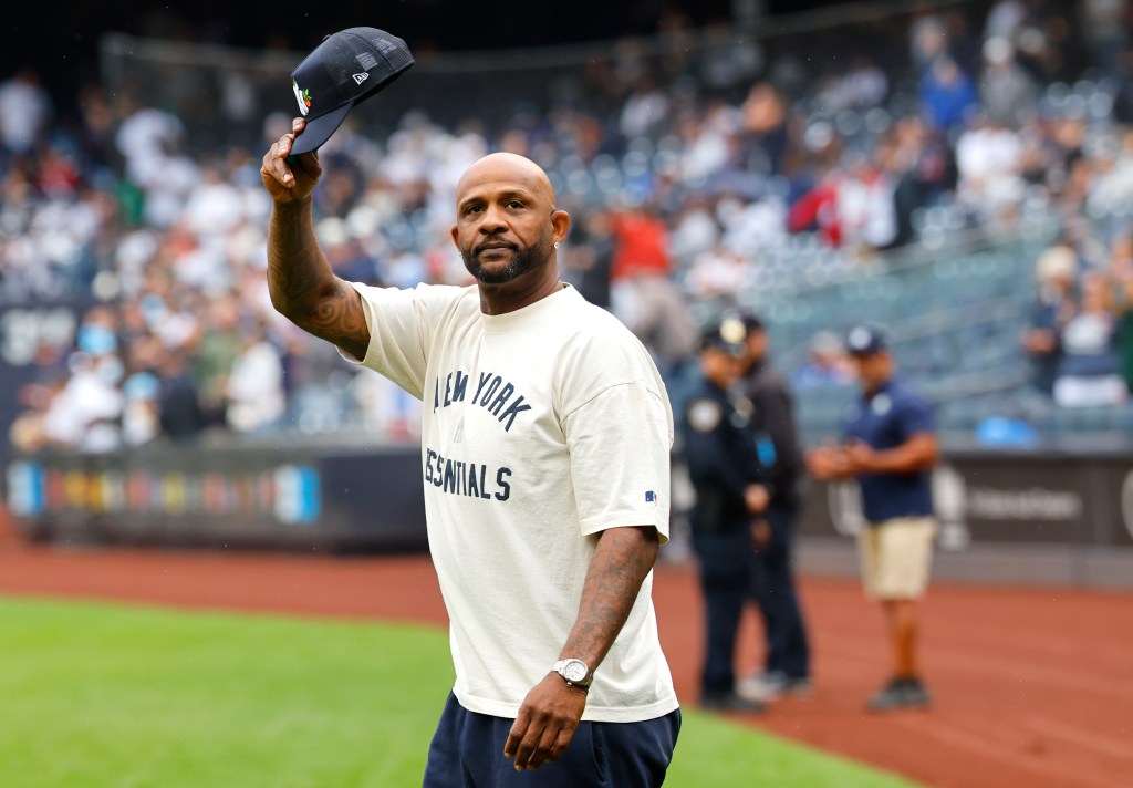 New York Yankees pinch hitter Clint Frazier #77 walks back to the dugout after striking out.