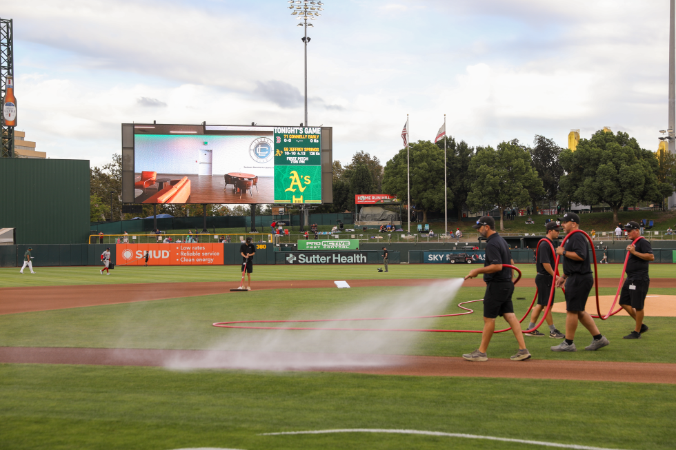 The double duty Sutter Health Park grounds crew, which is essentially the same group working both A’s and River Cats games, are at work before the Sept. 9 game.