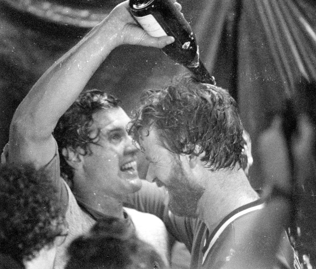 Cubs second baseman Ryne Sandberg, left, douses winning pitcher Rick Sutcliffe with champagne after the Cubs clinched the National League East title on Sept. 24, 1984, in Pittsburgh. (Ed Wagner Jr./Chicago Tribune)