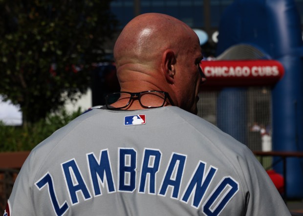 A Cubs fan rests his eyeglasses on his neck while walking outside before the NLDS Game 3 between the Cubs and Brewers at Wrigley Field on Oct. 8, 2025, in Chicago. (John J. Kim/Chicago Tribune)