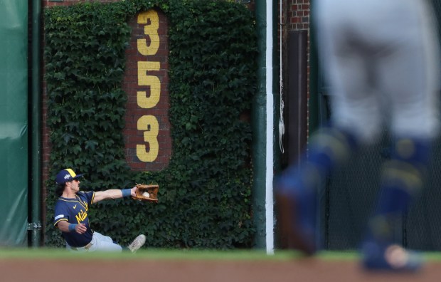 Brewers right fielder Sal Frelick catches a fly ball hit...