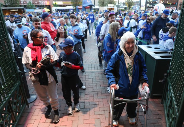 Fans wait to enter the ballpark for Game 4 of the NLCS between the Cubs and Brewers at Wrigley Field on Oct. 9, 2025, in Chicago. (John J. Kim/Chicago Tribune)